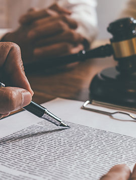 Judge gavel with Justice lawyers deciding, consultation on marriage divorce between married couple and signing divorce documents on table. Concepts of Law and Legal sevices.