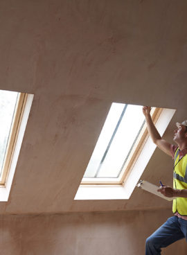 Building Inspector Looking At New Property