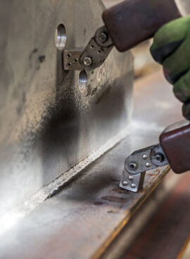 Magnetic particle inspection. The magnetizing pulse is applied for 0.5 seconds, during which the operator washes the part with the particle, stopping before the magnetic pulse is completed.